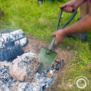 beggar's Chicken cooked in clay over a campfire