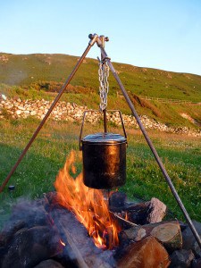 Campfire cooking with tripod